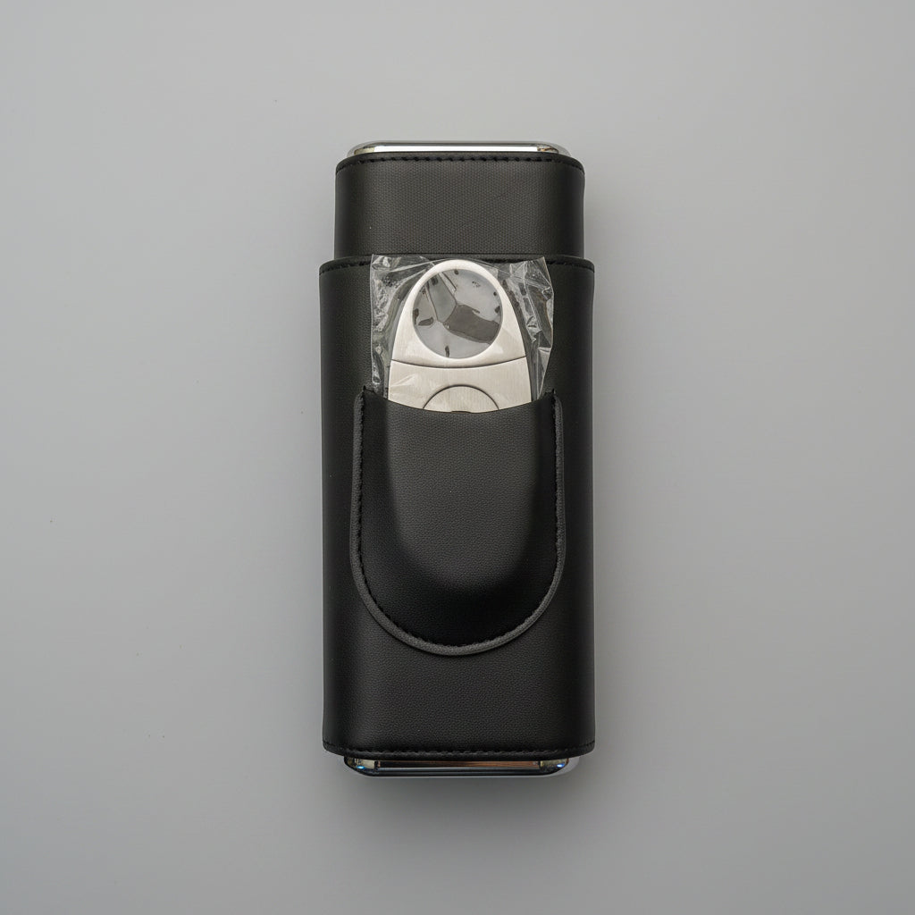 Black cigar case with a cigar cutter on a wooden surface