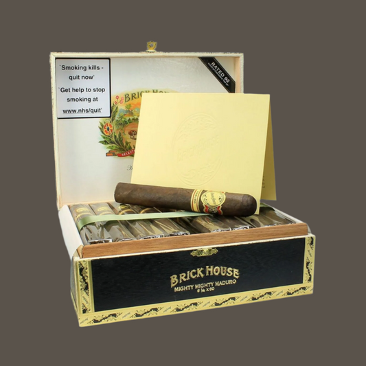 Open box of Brick House cigars with a single cigar on a white background