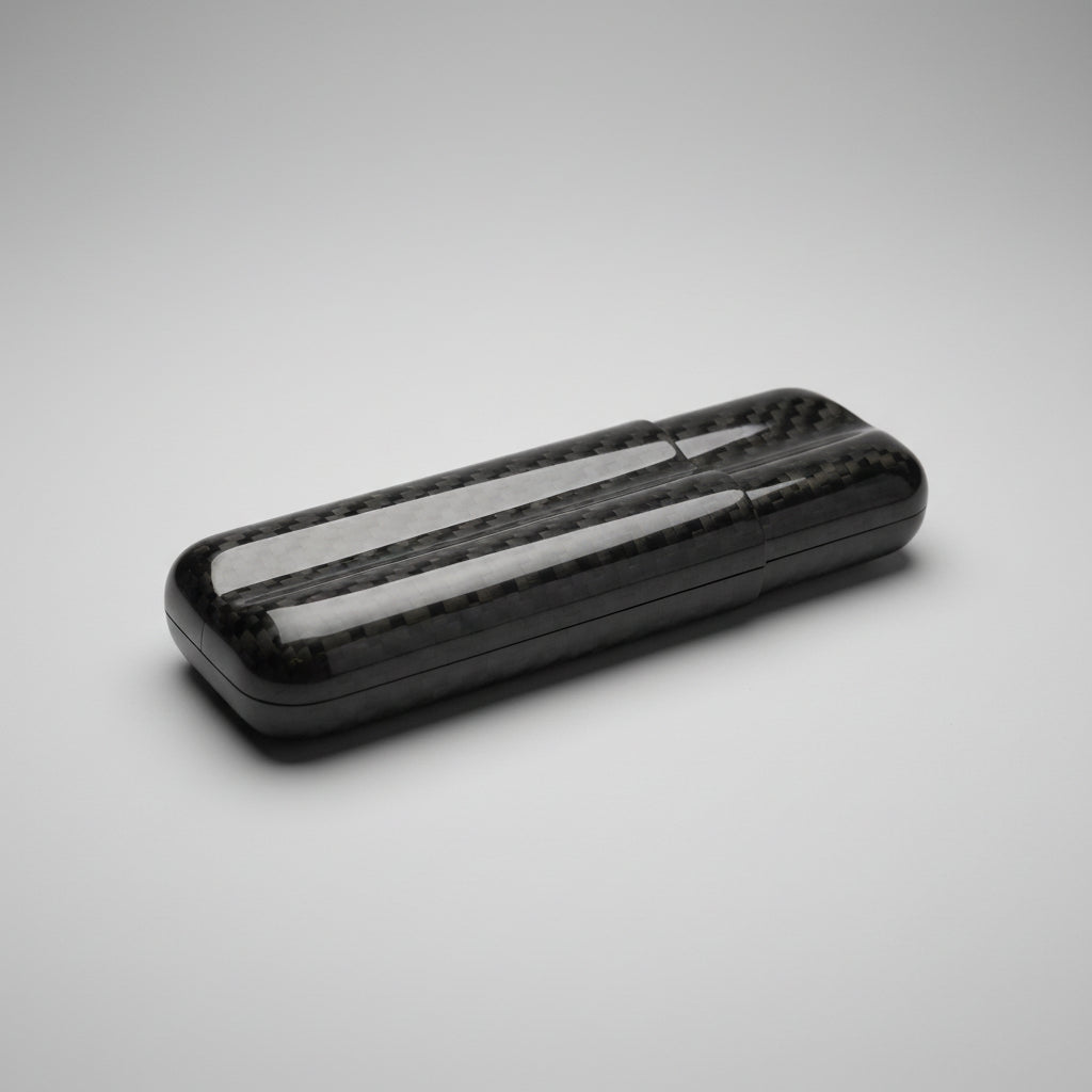 Carbon fiber cigar case with reflective surface on a wooden surface