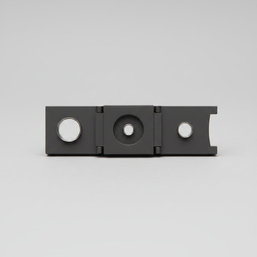 Black metal Cigar cutter on a wooden surface