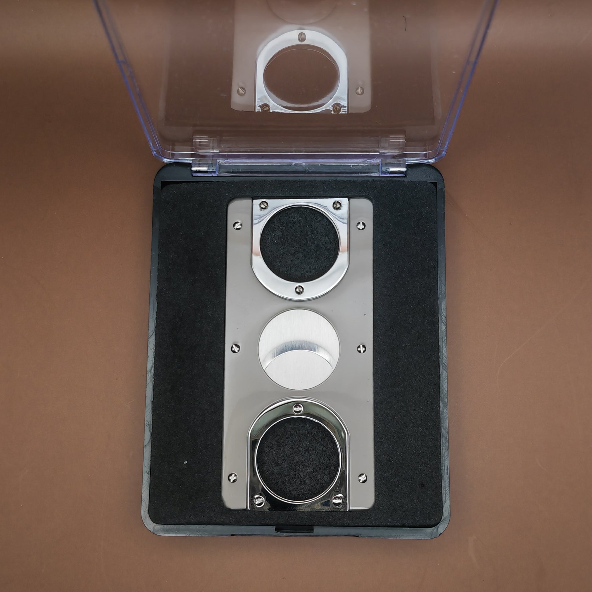 Close up of boxed two tone cigar cutter