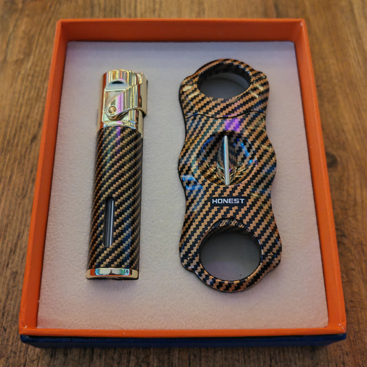 Carbon fiber lighters with 'Honest' branding in an orange box on a wooden surface