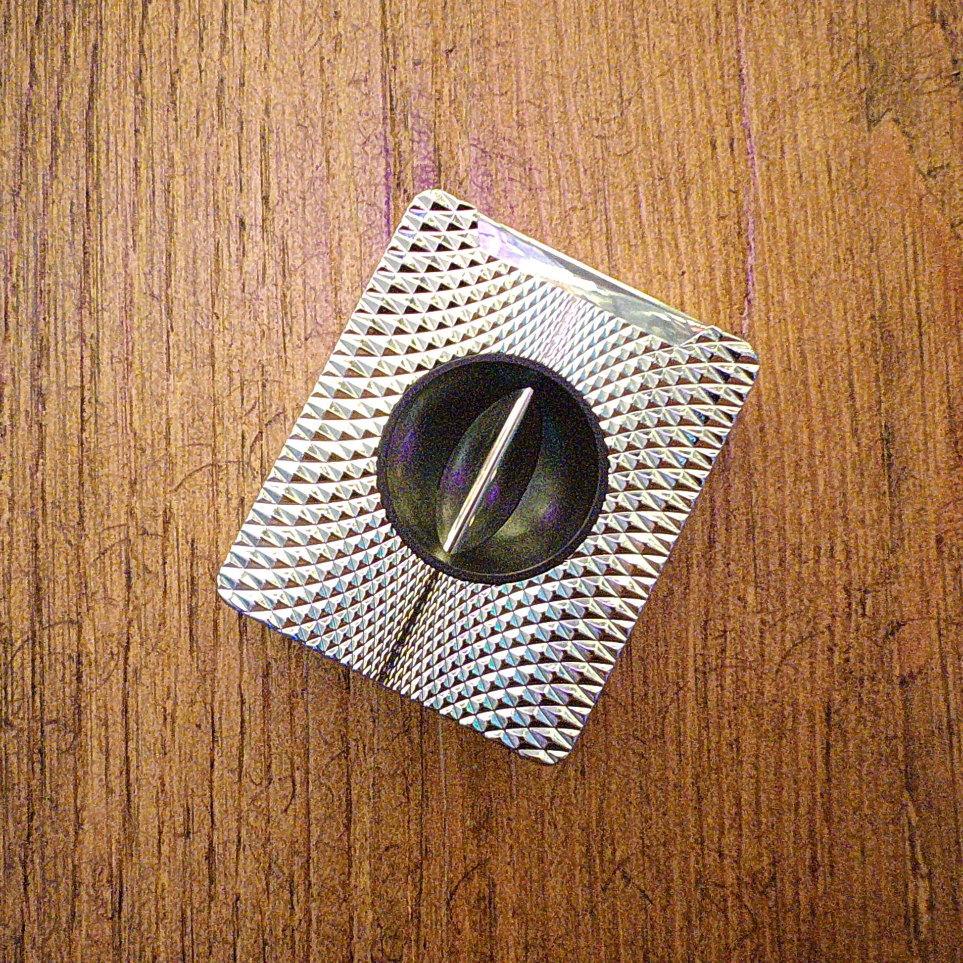 V-cut cigar cutter on wooden table