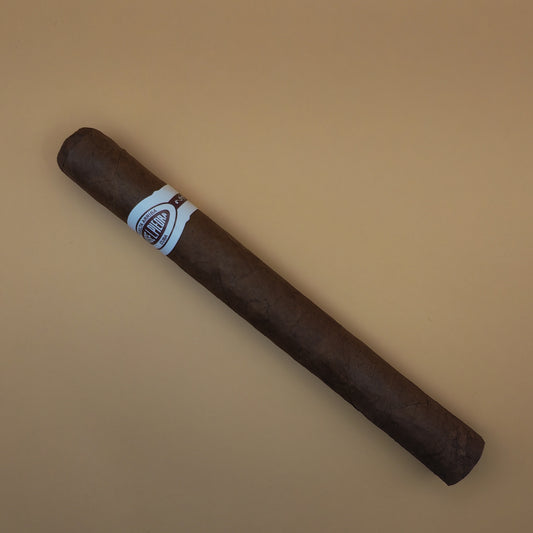 Cigar with a label on a beige background