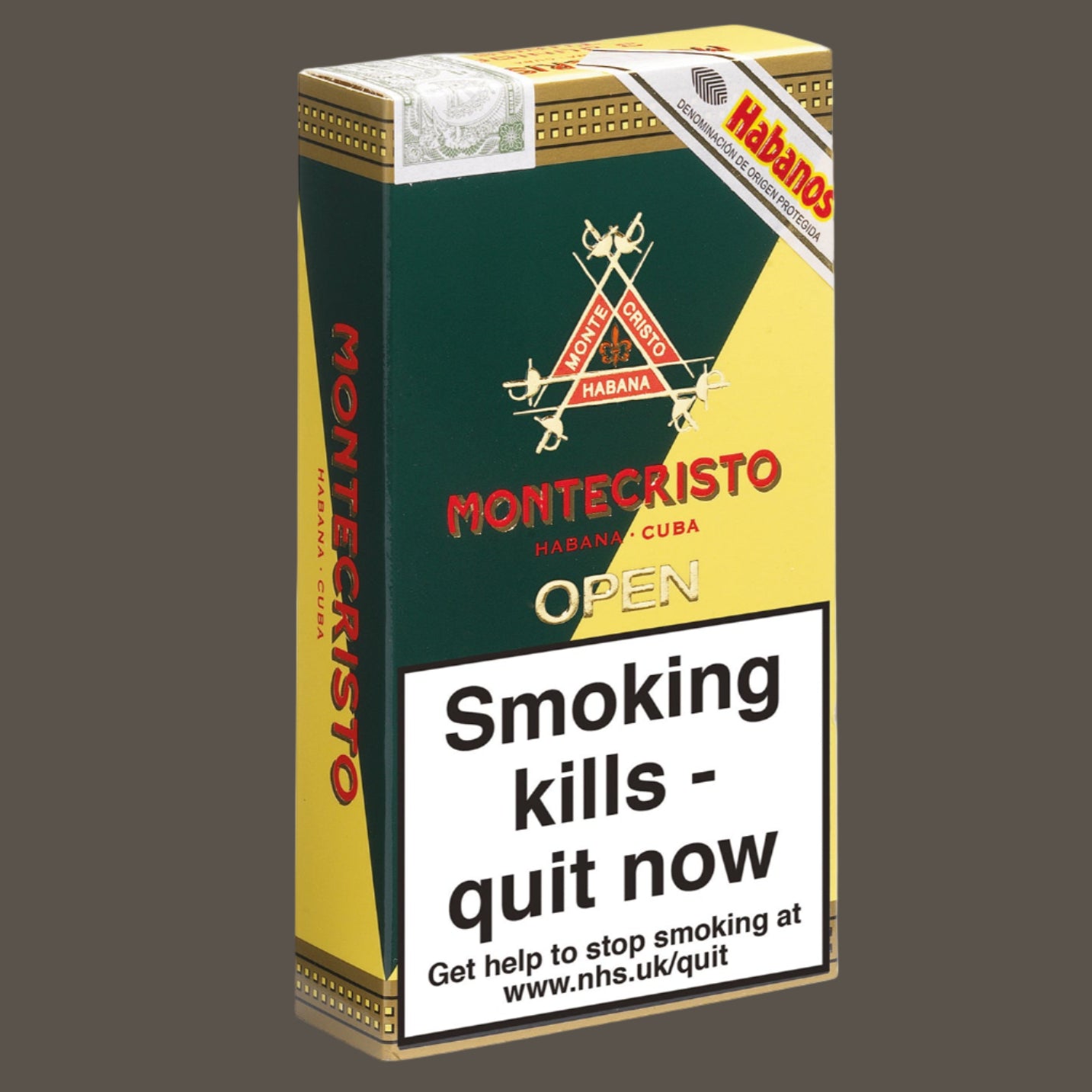 Montecristo cigarette pack with warning label on a white background