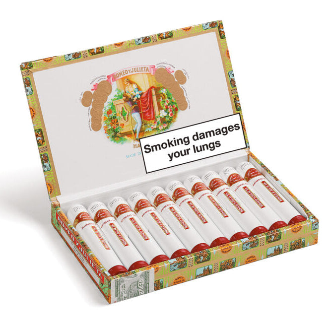 Open box of cigarettes with warning label on a white background