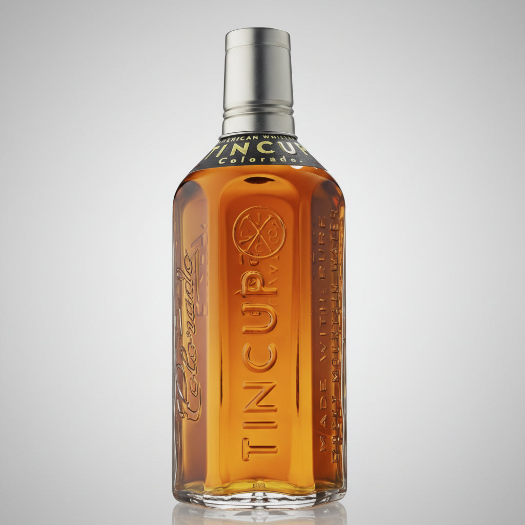Bottle of Tincup whiskey with a metal cap on a white background