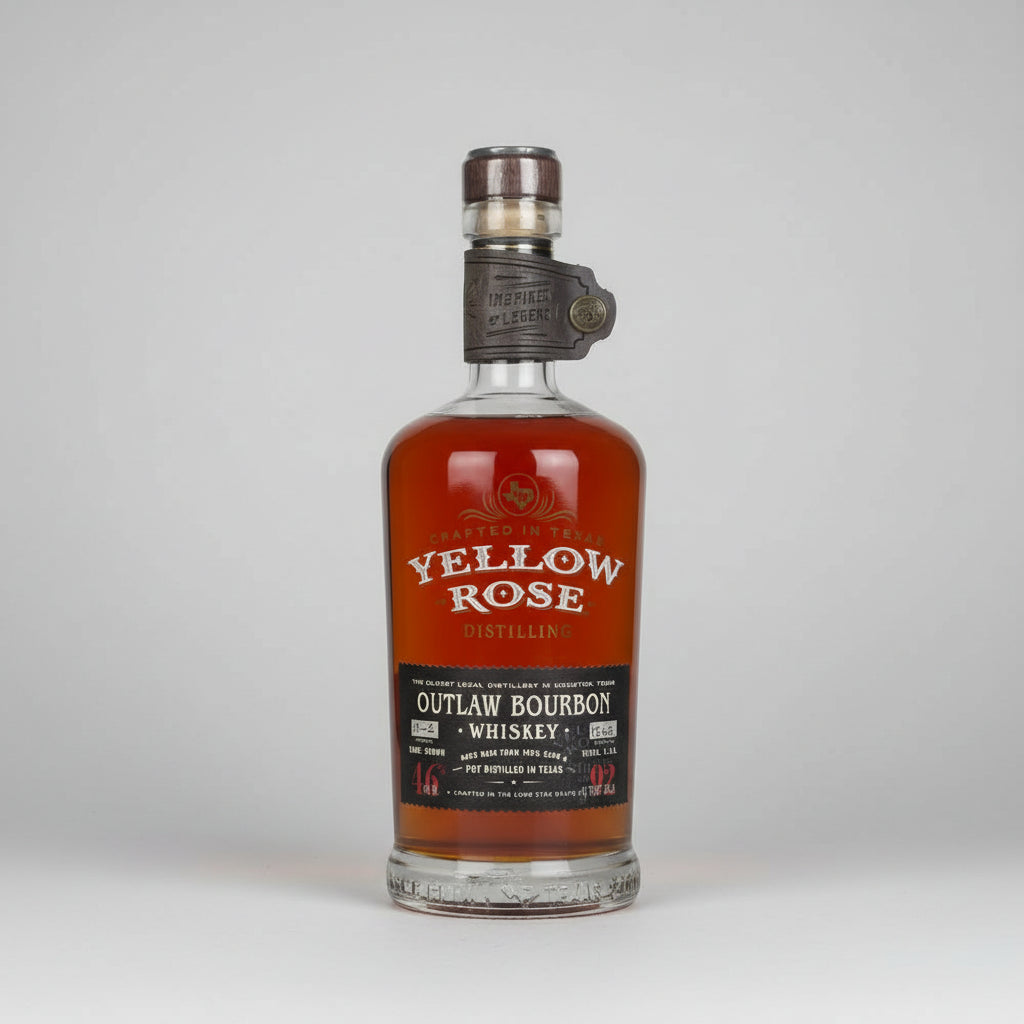 A bottle of Yellow Rose Outlaw Bourbon Whiskey on a white background with a soft reflection. The bottle contains amber-colored whiskey and features a black label with white text.