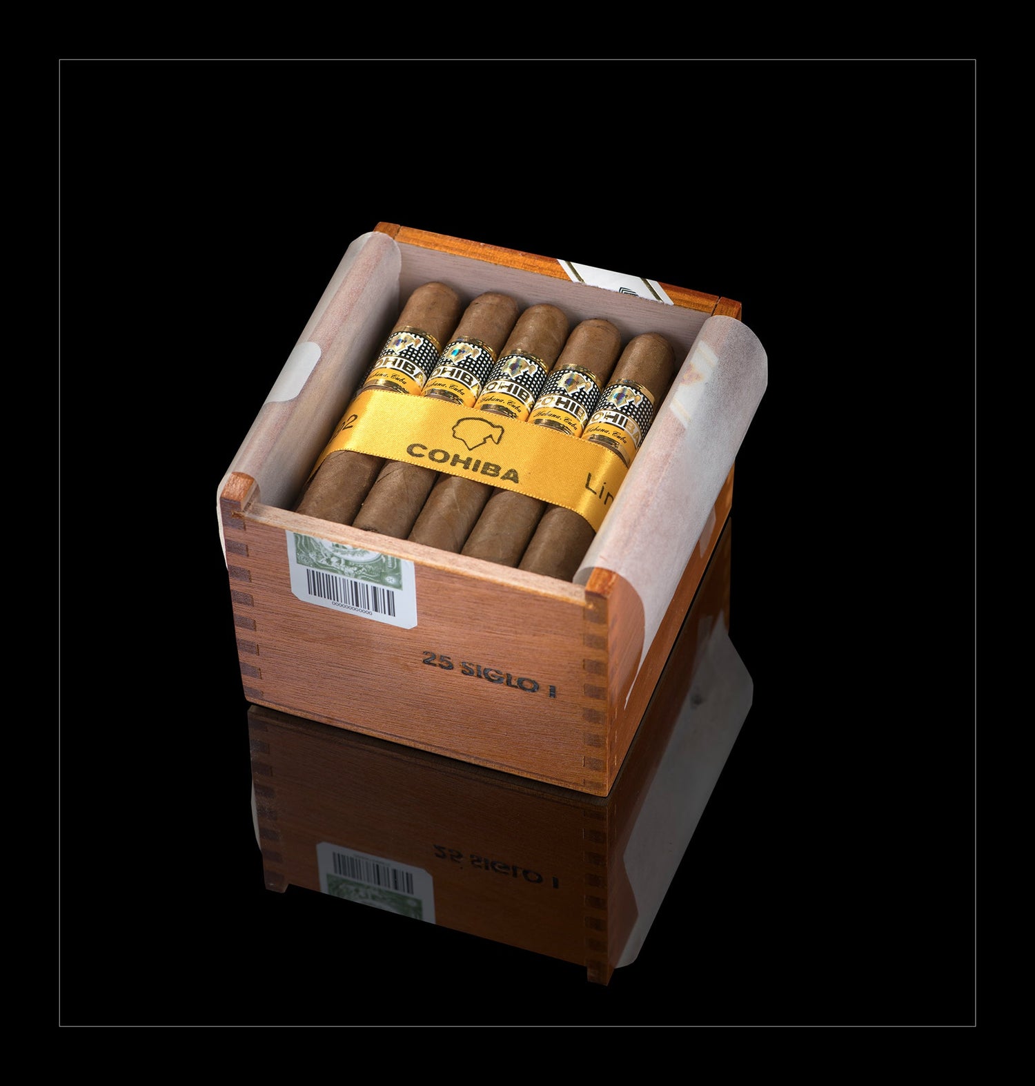 A Cohiba 25 Siglo I wooden cigar humidor box containing several brown cigars with gold bands, shown on a black reflective background.