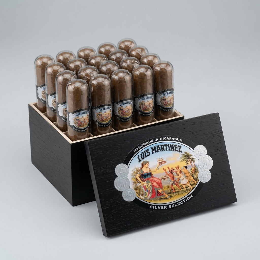 A display of Luis Martinez Silver Selection cigars in a black wooden box, with the lid leaning in front to show the brand's illustration and 'Silver Selection' text, set against a neutral gray background.