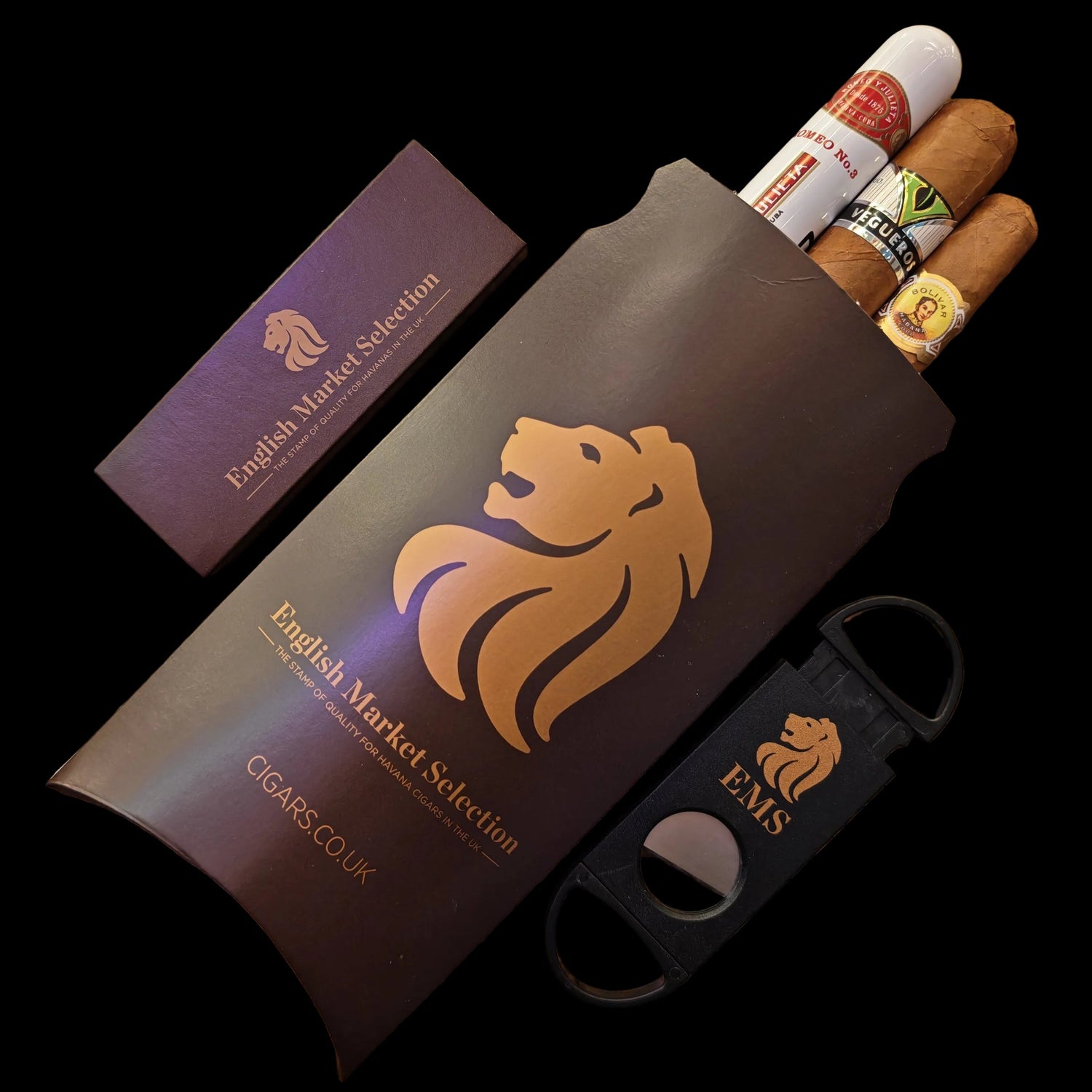 Cigar gift box with cigars, a cigar cutter, and a packet of cigar matches