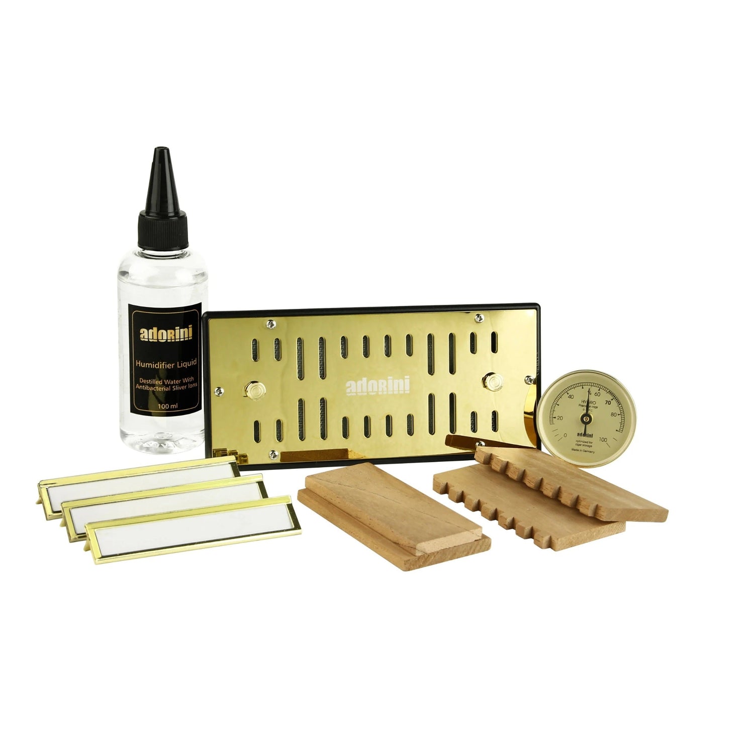 Set of Adonai products including a bottle, gold metal sheet, wooden blocks, and a gauge on a white background.