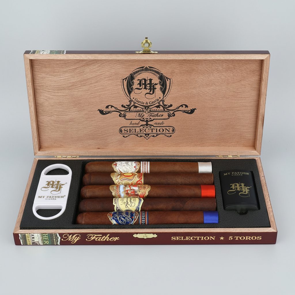 Open wooden cigar presentation box labeled 'My Father Selection' containing five cigars, a white cigar cutter, and a black lighter, all branded with the My Father logo.