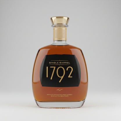 Single Barrel 1792 Kentucky Straight Bourbon Whiskey in a clear glass bottle with a gold cap and a black label featuring gold lettering.