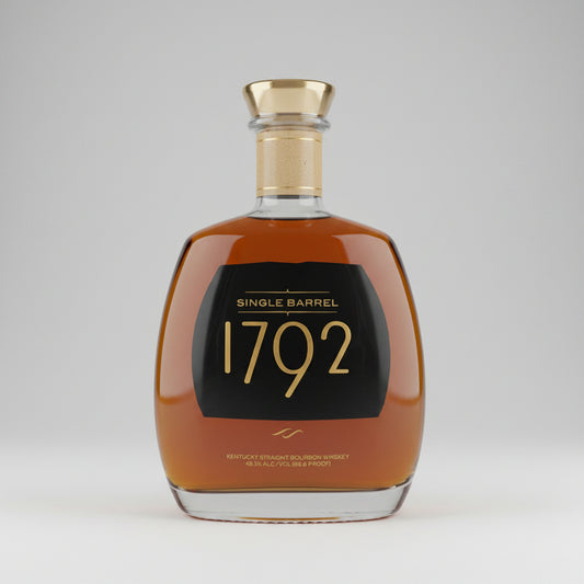 Single Barrel 1792 Kentucky Straight Bourbon Whiskey in a clear glass bottle with a gold cap and a black label featuring gold lettering.
