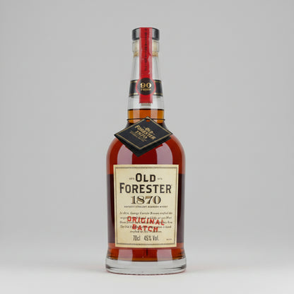 A bottle of Old Forester 1870 Original Batch american  whisky, featuring a cream-colored label, amber liquid, and a red neck seal with a gold 90th anniversary emblem.