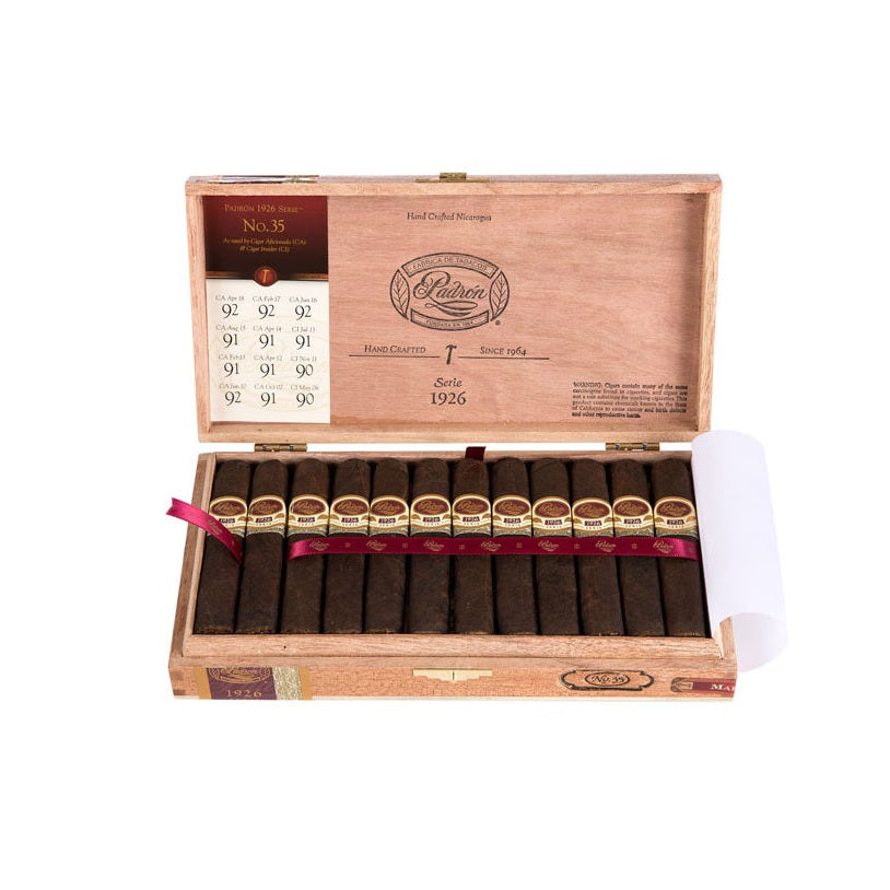 Wooden humidor with cigars on a white background