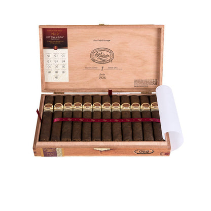 Open wooden cigar box with cigars inside on a white background