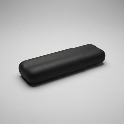 A black carbon fiber case with a matt finish, shown closed on a neutral gray background.