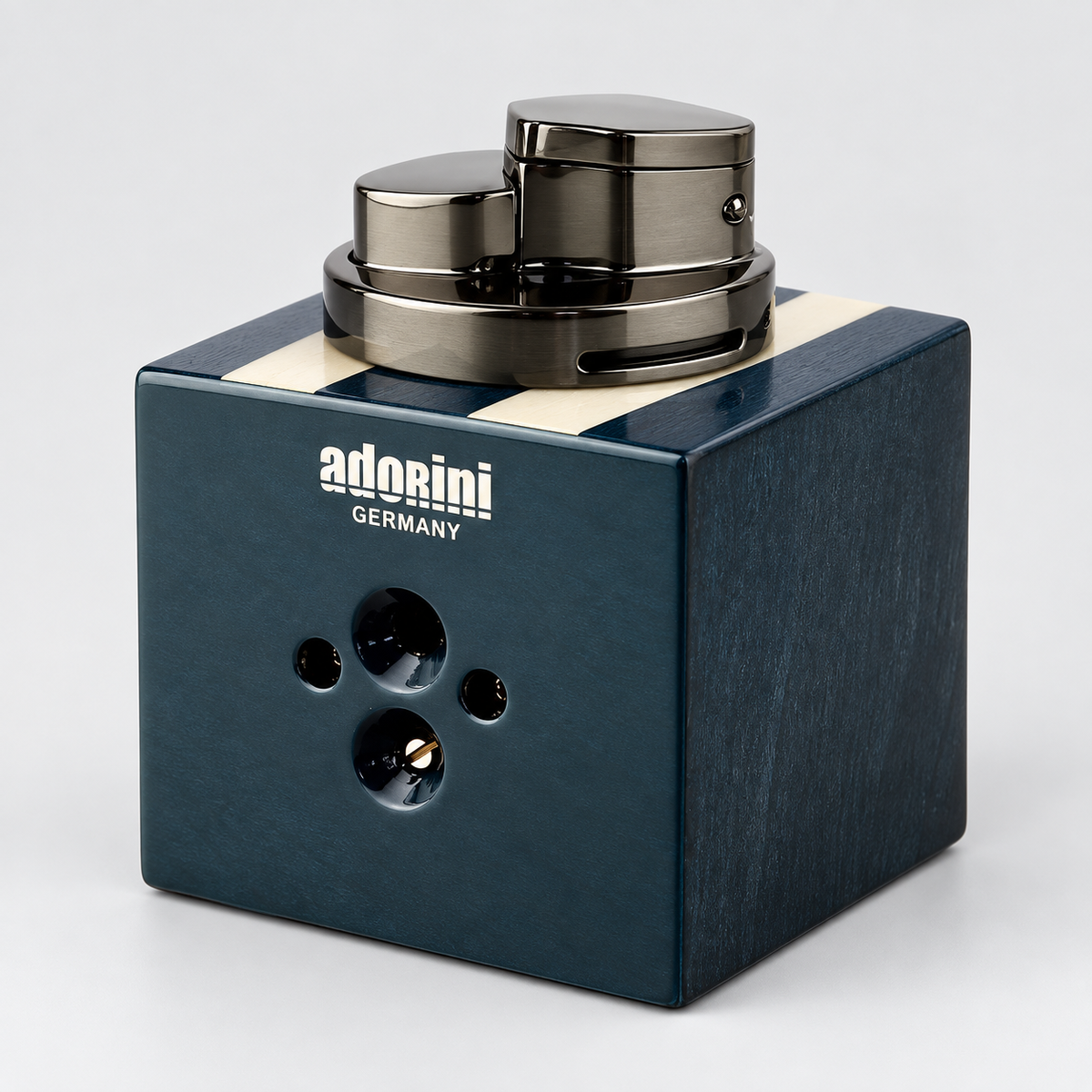 A dark blue wooden cigar holder with a metallic gunmetal cylinder on top, featuring the 'adorini GERMANY' logo on the front, set against a light gray background.