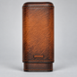 A brown textured leather cigar case with visible stitching and the brand name 'adorini' embossed near the bottom, photographed against a neutral gray background.