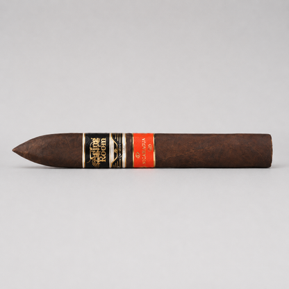 A single dark brown cigar with a black and gold band reading 'Cigar Room' and a red band, photographed horizontally against a light gray background.