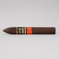 A single dark brown cigar with a black and gold band reading 'Cigar Room' and a red band, photographed horizontally against a light gray background.