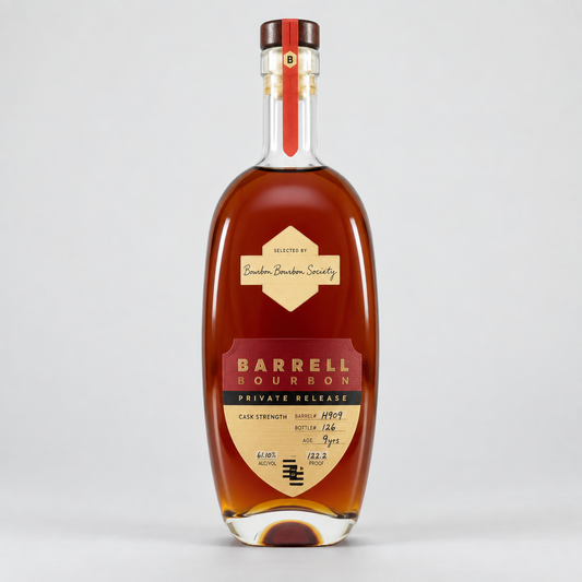 A bottle of Barrel Bourbon Private Release cognac whiskey, featuring a clear glass bottle filled with amber liquid, a cream and red label, and a dark brown cap, set against a light gray background.