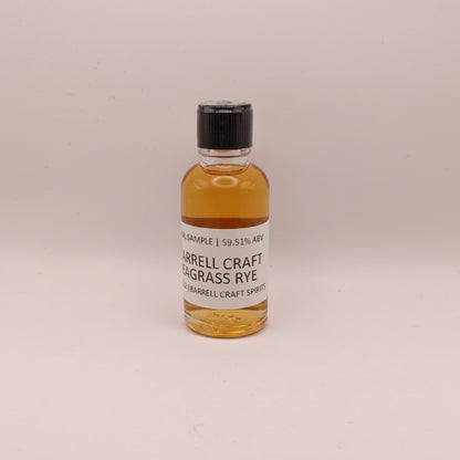 Small bottle of Barrell Craft Seagrass Rye on a light gray background