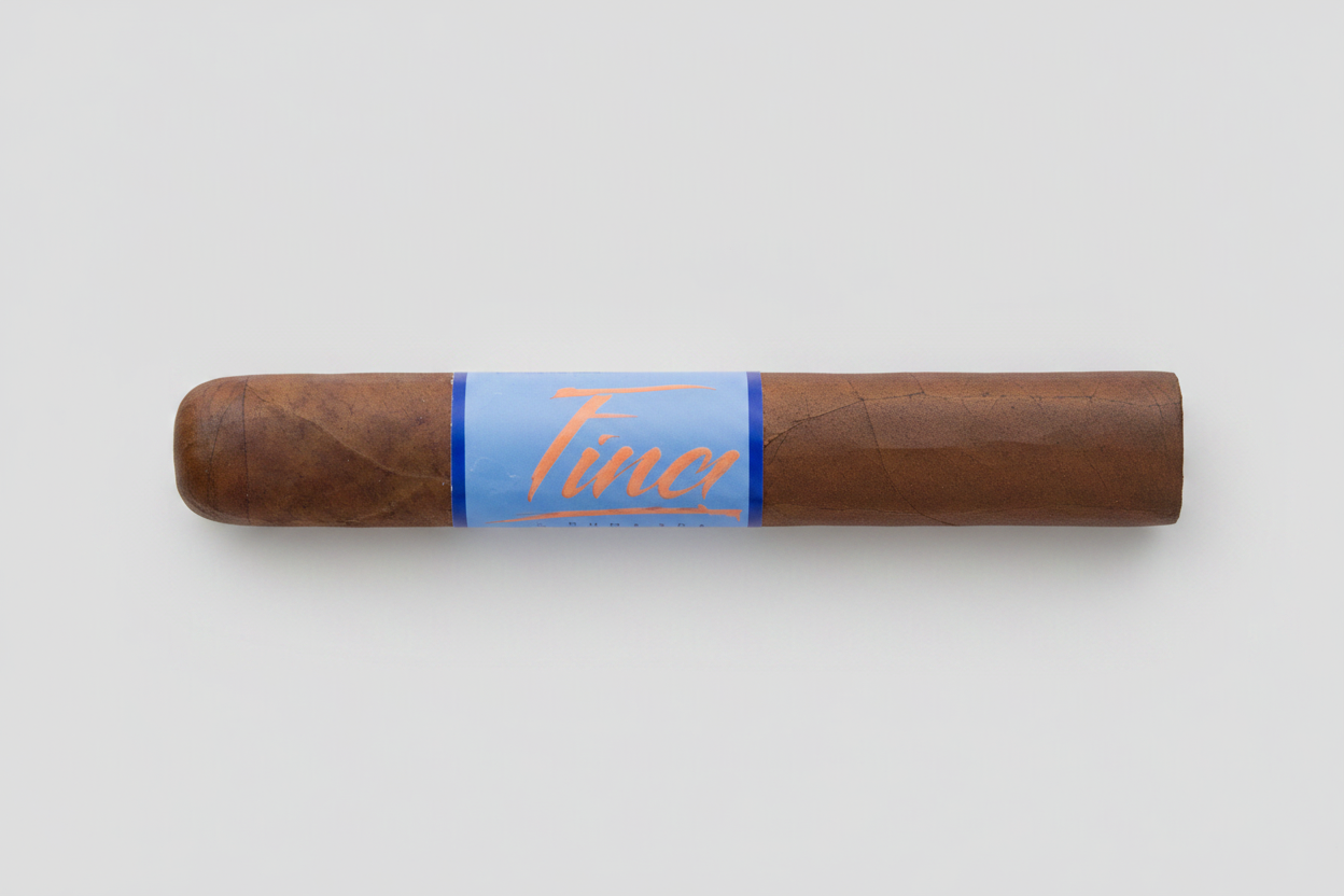 Cigar with a blue wrapper and 'Finch' branding