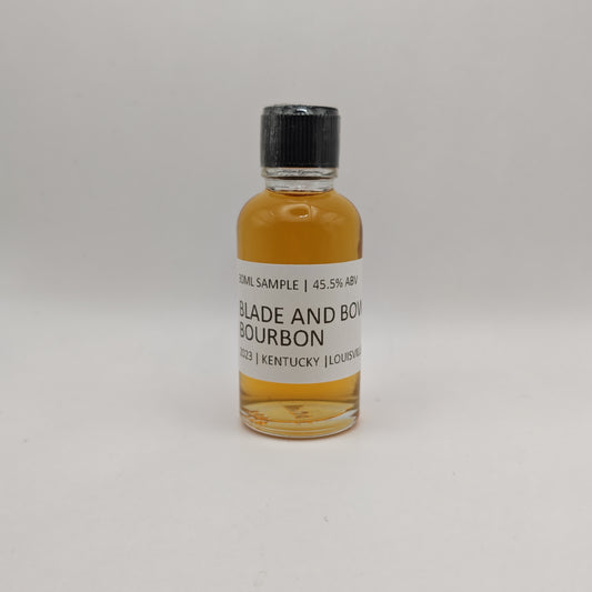 Small bottle of Blade and Bow Bourbon on a light gray background