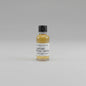 Small bottle of Blanton's Green Vintage whiskey sample on a beige background