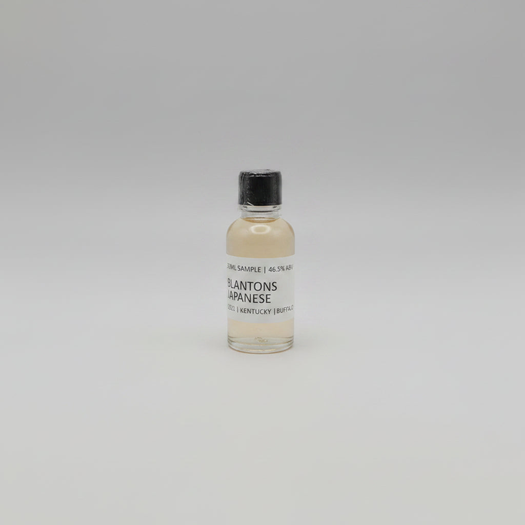 Small bottle of Blanton's Japanese Whisky on a pink background