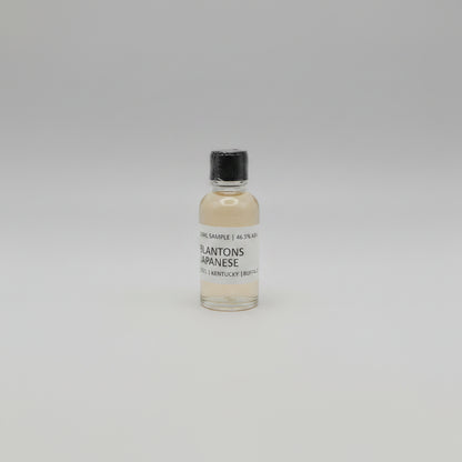 Small bottle of Blanton's Japanese Whisky on a pink background