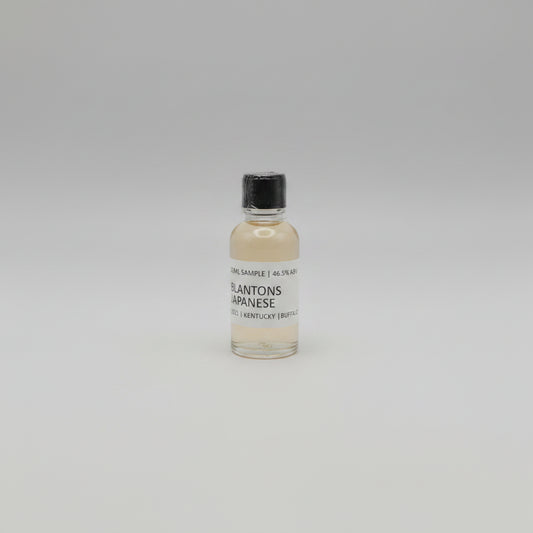 Small bottle of Blanton's Japanese Whisky on a pink background