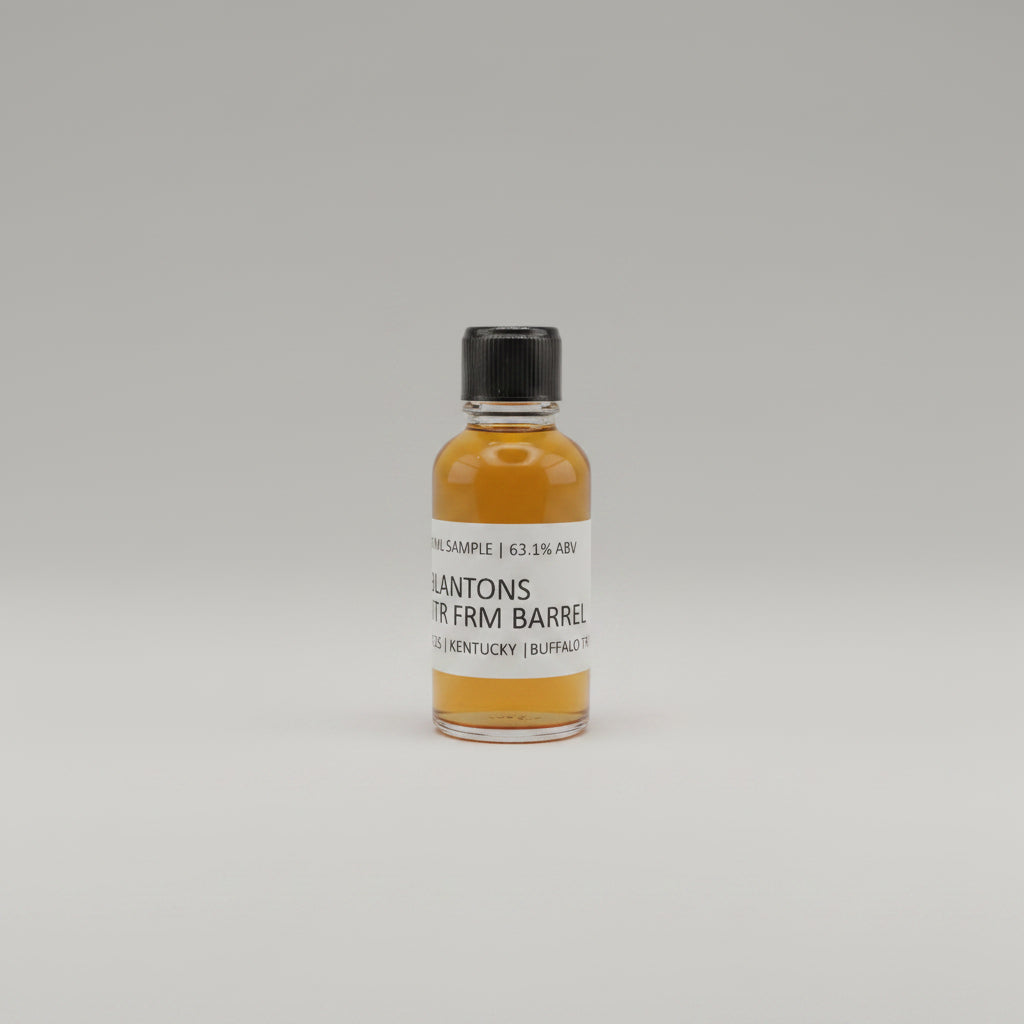 Small bottle of Blantons Whiskey on a beige background