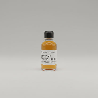 Small bottle of Blantons Whiskey on a beige background