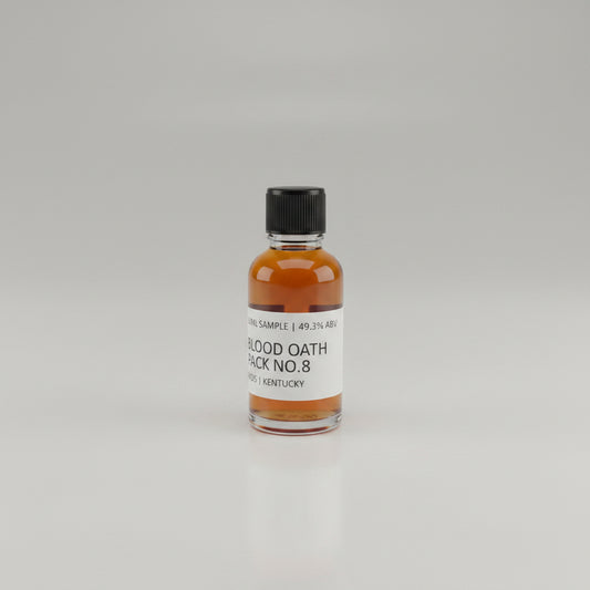 Small bottle of Blood Oath Whiskey Sample on a light pink background