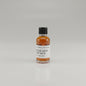Small bottle of Blood Oath Whiskey Sample on a light pink background