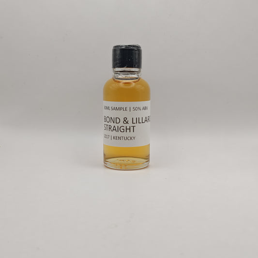 Small bottle of Bond & Lillie Straight whiskey sample on a gray background