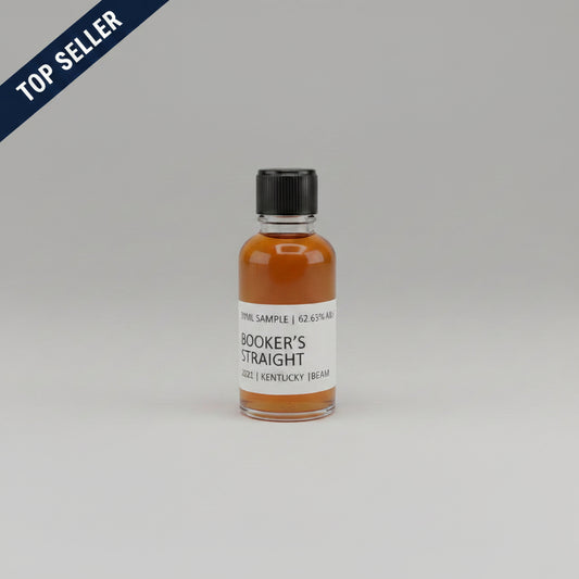 Bottle of Booker's Straight bourbon whiskey on a light pink background