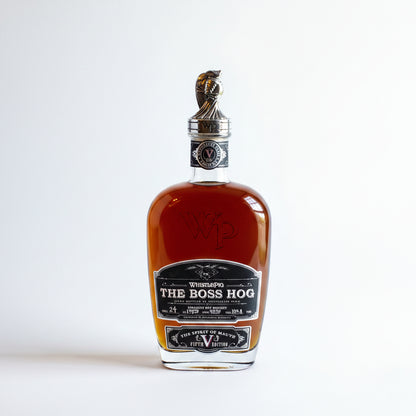 Bottle of 'The Boss Hog' whiskey with packaging on a white background
