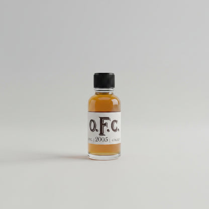 Bottle of O.F.C. 2005 on a blurred white background