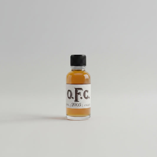 Bottle of O.F.C. 2005 on a blurred white background