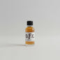 Bottle of O.F.C. 2005 on a blurred white background