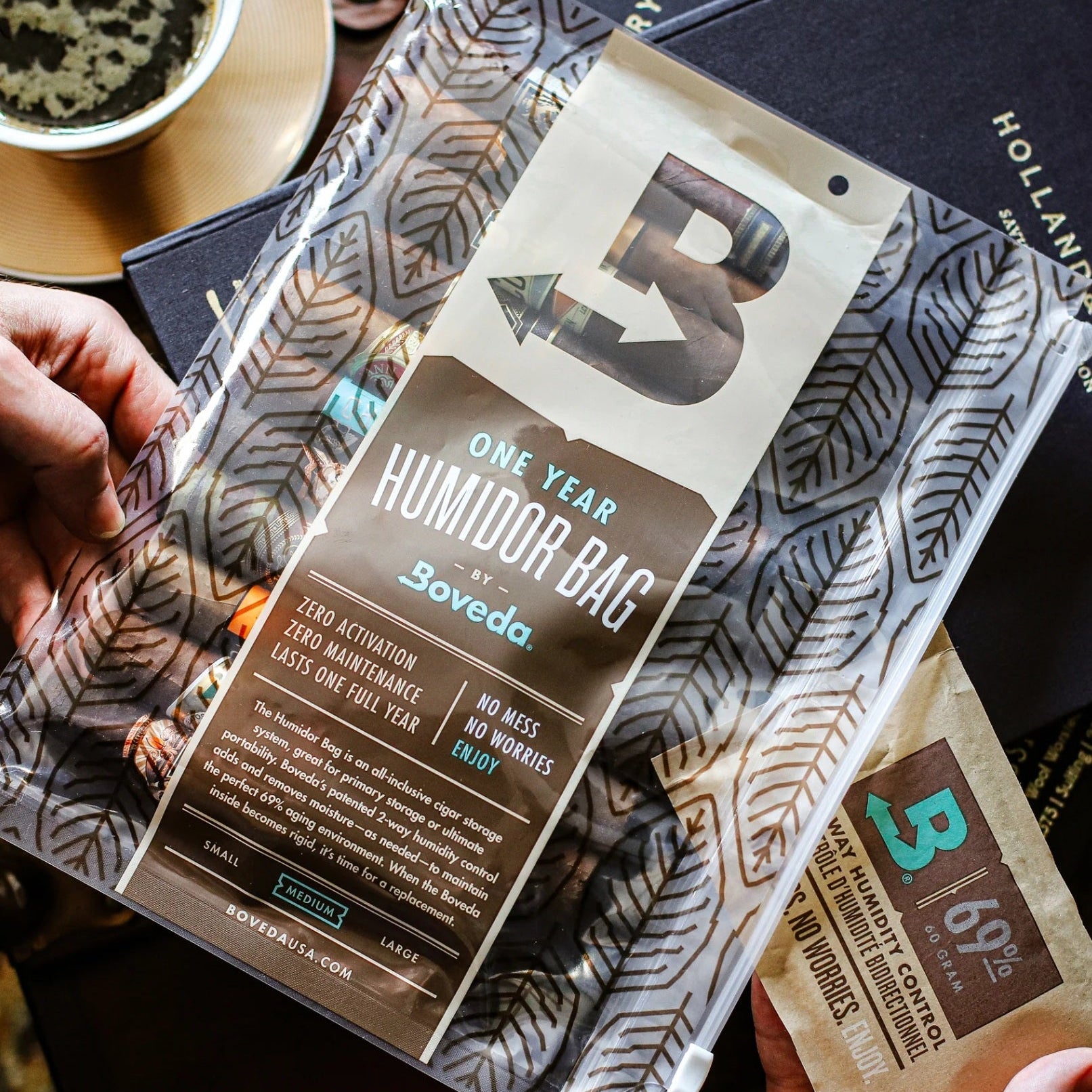 Soveda one-year humidifier bag packaging held by a hand with a blurred background.