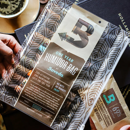 Soveda one-year humidifier bag packaging held by a hand with a blurred background.