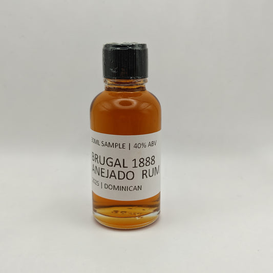 Small bottle of Brugal 1888 Anejo Rum on a white background