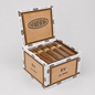 An open box of Buena Ventura 20 Mini cigars on a light gray background. The box is made of natural wood with white and black printed branding, and several cigars are neatly arranged inside.