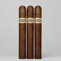 A single brown cigar standing upright against a light gray background, featuring a gold and black band with the brand name 'Crementillo'.